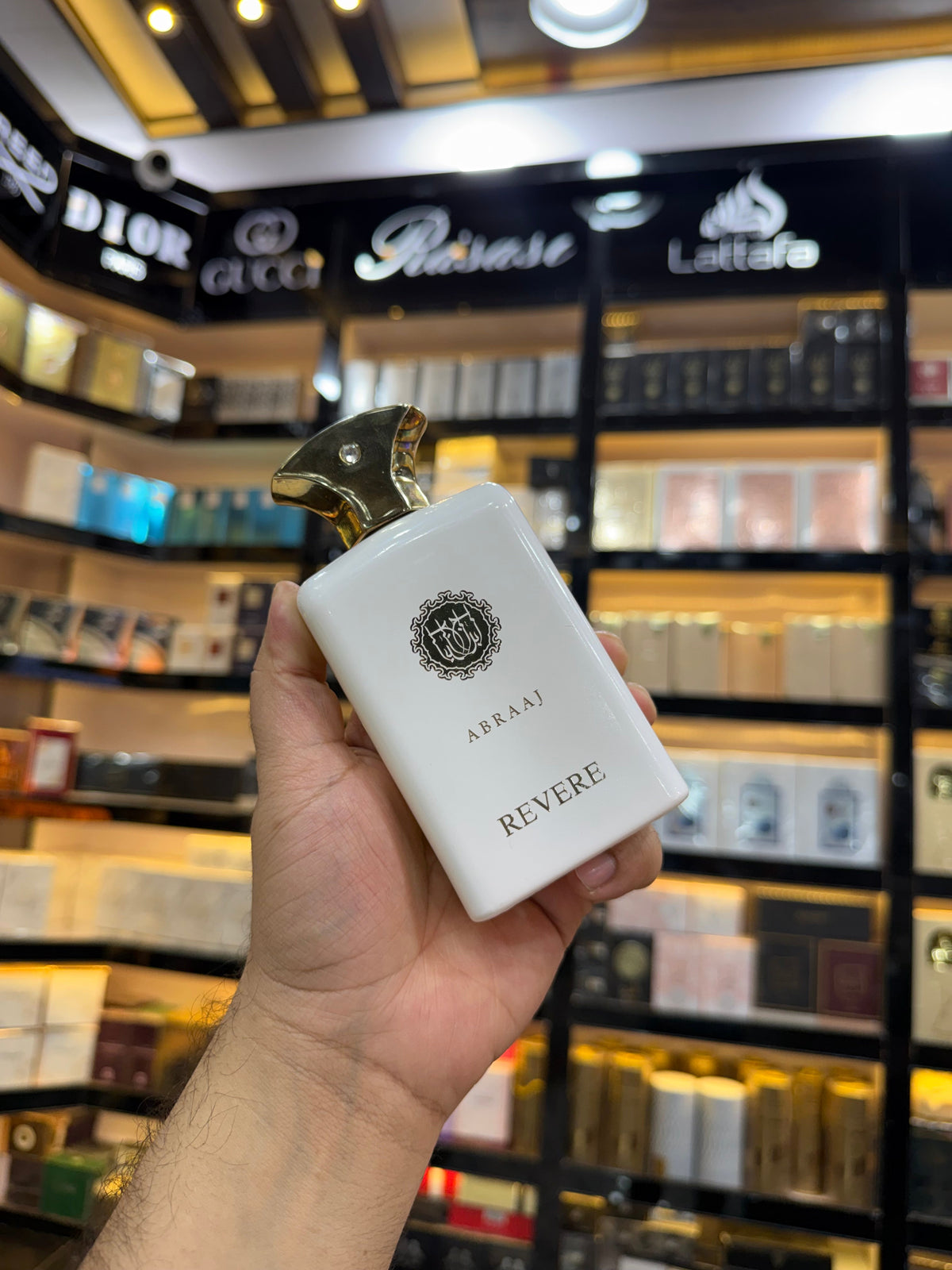 This is Abraaj Revere Eau de Parfum (100ml) — a stylish, budget-friendly fragrance often found in Middle Eastern-style perfume collections. (Allaow to open)