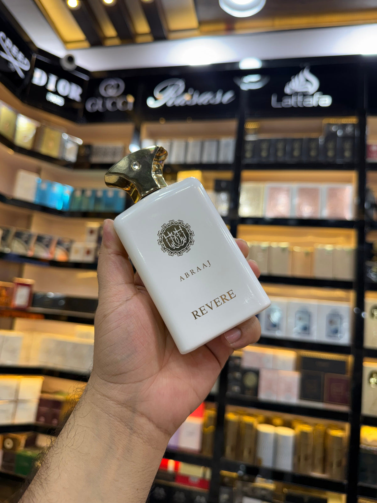 This is Abraaj Revere Eau de Parfum (100ml) — a stylish, budget-friendly fragrance often found in Middle Eastern-style perfume collections. (Allaow to open)